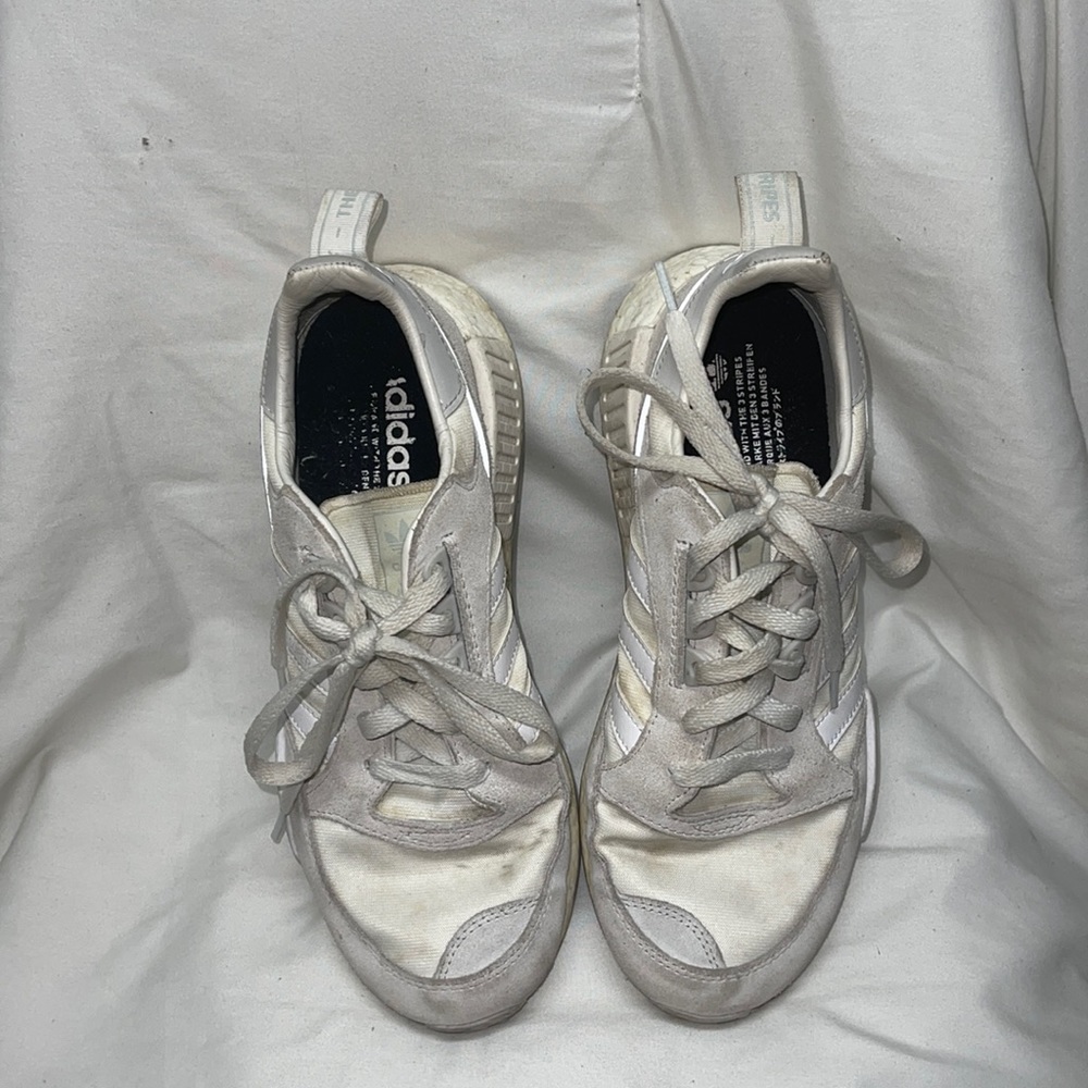 Gray + Off-White (color not brand) Addidas NMDs